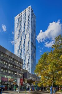 11 Hoyt Street in Downtown Brooklyn is a residential condo skyscraper with a unique wavy white facade of precast concrete panels and drive-through motor court. Designed by Studio Gang architects.