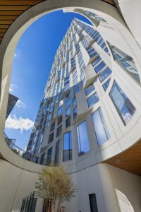 11 Hoyt Street in Downtown Brooklyn is a residential condo skyscraper with a unique wavy white facade of precast concrete panels and drive-through motor court. Designed by Studio Gang architects.