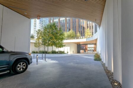 11 Hoyt Street in Downtown Brooklyn is a residential condo skyscraper with a unique wavy white facade of precast concrete panels and drive-through motor court. Designed by Studio Gang architects.