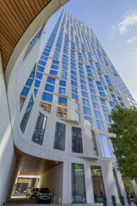 11 Hoyt Street in Downtown Brooklyn is a residential condo skyscraper with a unique wavy white facade of precast concrete panels and drive-through motor court. Designed by Studio Gang architects.