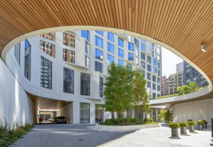 11 Hoyt Street in Downtown Brooklyn is a residential condo skyscraper with a unique wavy white facade of precast concrete panels and drive-through motor court. Designed by Studio Gang architects.