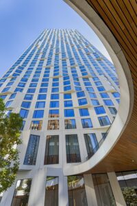 11 Hoyt Street in Downtown Brooklyn is a residential condo skyscraper with a unique wavy white facade of precast concrete panels and drive-through motor court. Designed by Studio Gang architects.