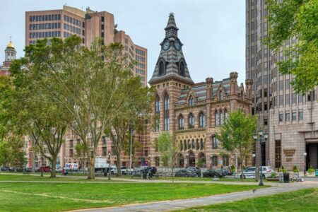 New Haven’s City Hall was built in 1861, designed by Henry Austin; the County Courthouse annex was completed in 1873, designed by David R. Brown.