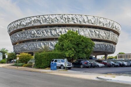 Enterprise Center/Markel Building, inspired by a foil-wrapped baked potato the architect consumed at an American Institute of Architects dinner. Each floor is clad in a 555-foot sledge-hammered sheet of aluminum.