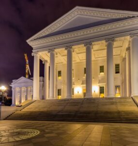 The Virginia State Capitol core – the building minus the wings that were added in 1906 – was designed by Thomas Jefferson and Charles-Louis Clerisseau in the image of a Roman Temple, Maison Caree. The neo-Classical temple form is said to have set a design precedent for public buildings in the United States. In keeping with the “temple” form, the building is one of a dozen U.S. state capitols without an exterior dome. Inside, however, the central rotunda is domed.