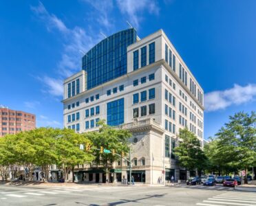 Theater Row Building is a Postmodern office building constructed behind the façade of the 1921 Colonial Theater – next door to the historic National Theater.