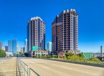 Riverfront Plaza is a pair of red granite-faced office towers overlooking Kanawha Canal and James River, just east of the Federal Reserve Bank of Richmond.