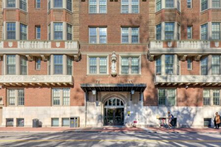 Johnson Hall was built in 1915 as the Monroe Terrace Apartments, designed by Alfred C. Bossom in neo-Gothic style.