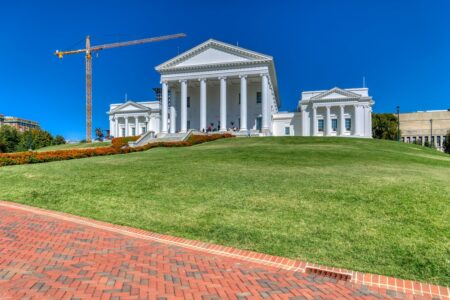 The Virginia State Capitol core – the building minus the wings that were added in 1906 – was designed by Thomas Jefferson and Charles-Louis Clerisseau in the image of a Roman Temple, Maison Caree. The neo-Classical temple form is said to have set a design precedent for public buildings in the United States. In keeping with the “temple” form, the building is one of a dozen U.S. state capitols without an exterior dome. Inside, however, the central rotunda is domed.