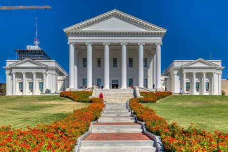 The Virginia State Capitol core – the building minus the wings that were added in 1906 – was designed by Thomas Jefferson and Charles-Louis Clerisseau in the image of a Roman Temple, Maison Caree. The neo-Classical temple form is said to have set a design precedent for public buildings in the United States. In keeping with the “temple” form, the building is one of a dozen U.S. state capitols without an exterior dome. Inside, however, the central rotunda is domed.