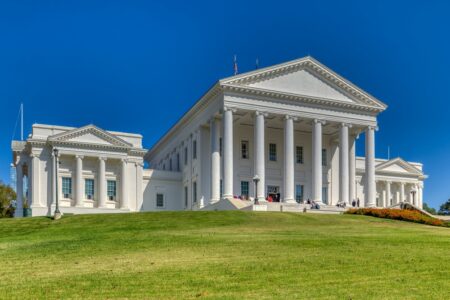 The Virginia State Capitol core – the building minus the wings that were added in 1906 – was designed by Thomas Jefferson and Charles-Louis Clerisseau in the image of a Roman Temple, Maison Caree. The neo-Classical temple form is said to have set a design precedent for public buildings in the United States. In keeping with the “temple” form, the building is one of a dozen U.S. state capitols without an exterior dome. Inside, however, the central rotunda is domed.