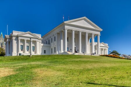 The Virginia State Capitol core – the building minus the wings that were added in 1906 – was designed by Thomas Jefferson and Charles-Louis Clerisseau in the image of a Roman Temple, Maison Caree. The neo-Classical temple form is said to have set a design precedent for public buildings in the United States. In keeping with the “temple” form, the building is one of a dozen U.S. state capitols without an exterior dome. Inside, however, the central rotunda is domed.